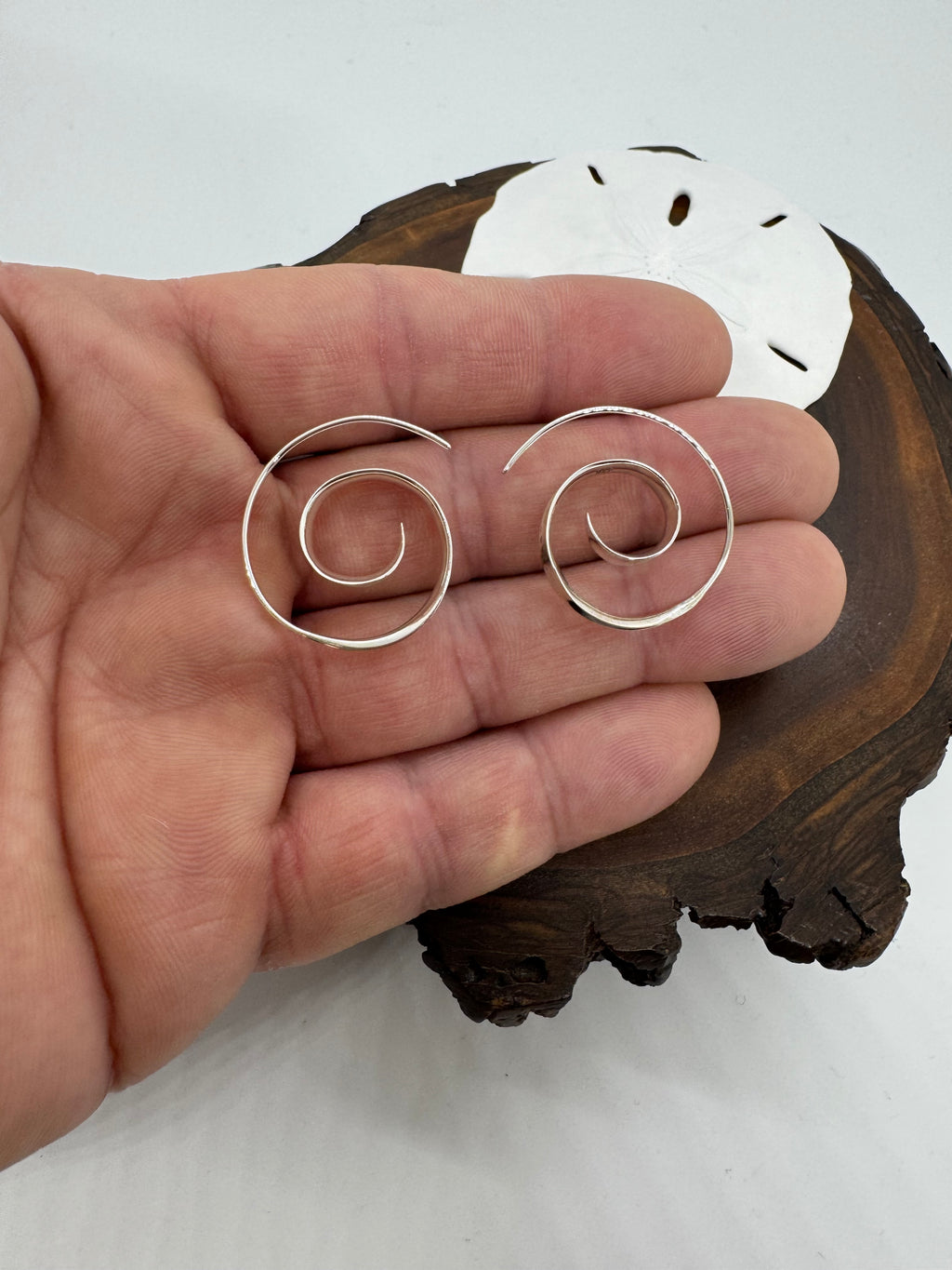 Title swirl earrings